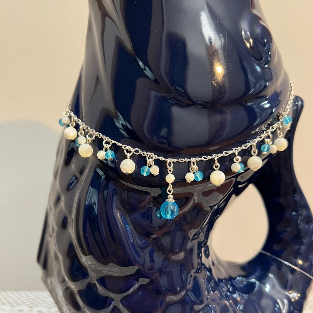 2028 silver tone with white and blue dangling beads necklace